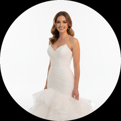 Rachel Adams, a North American woman, smiling in a custom ruffle mermaid wedding dress, against a clean white background.
